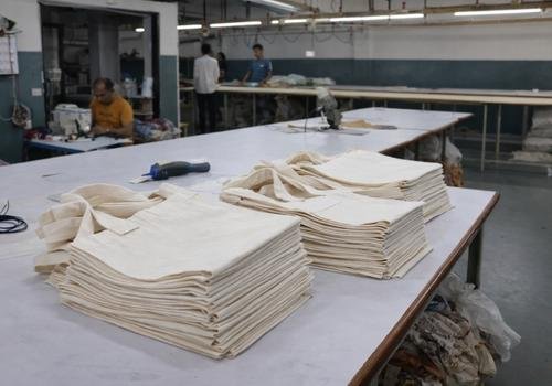 Cotton tote bag cutting and production in factory.